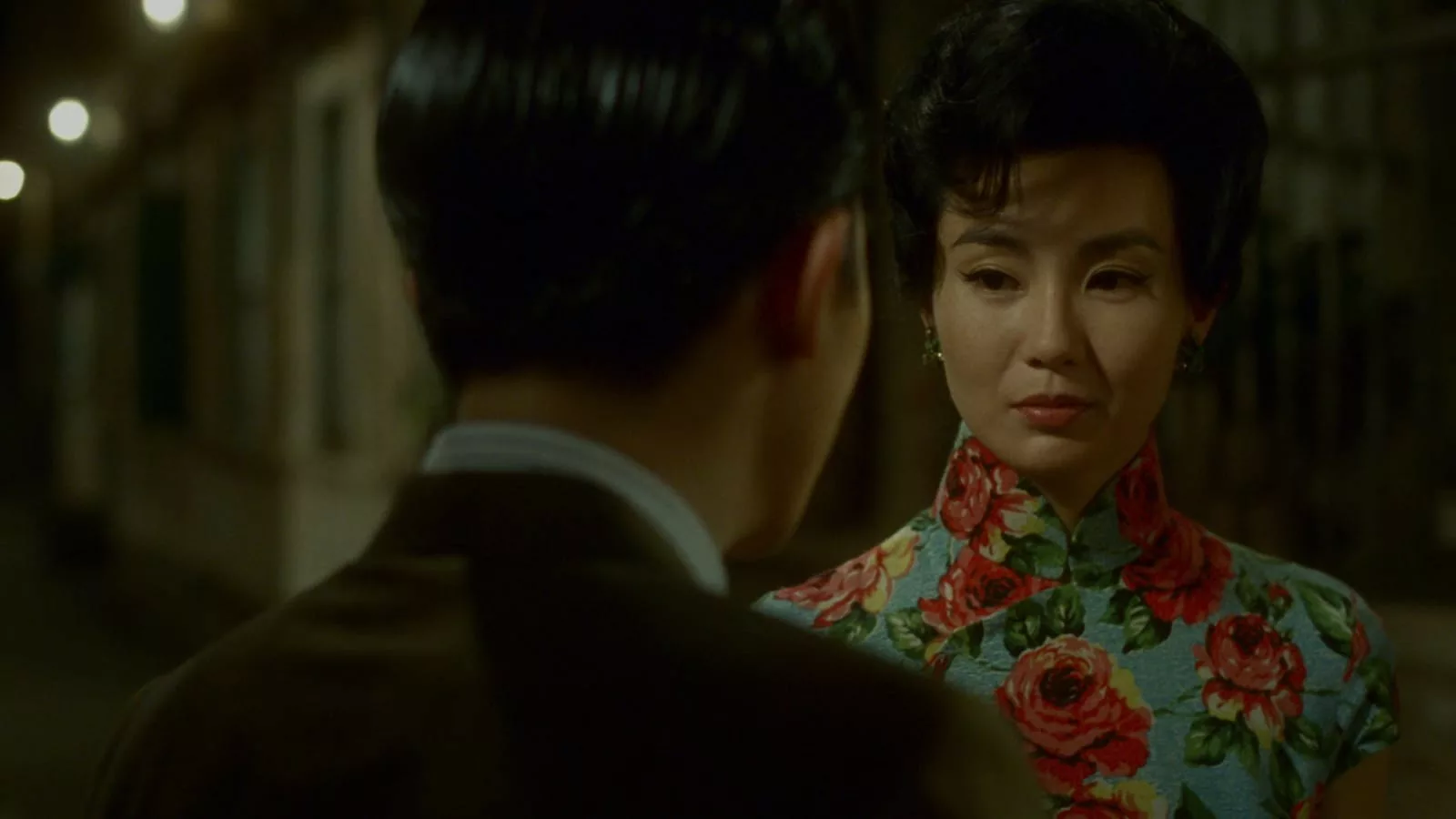 In Wong Kar Wai's In the Mood for Love drama, Chow Mo-wan (by Tony Leung Chiu-wai) runs into his neighbor Su Li-zhen in a flowered dress (Maggie Cheung Man-yuk) as they fall in love with each other