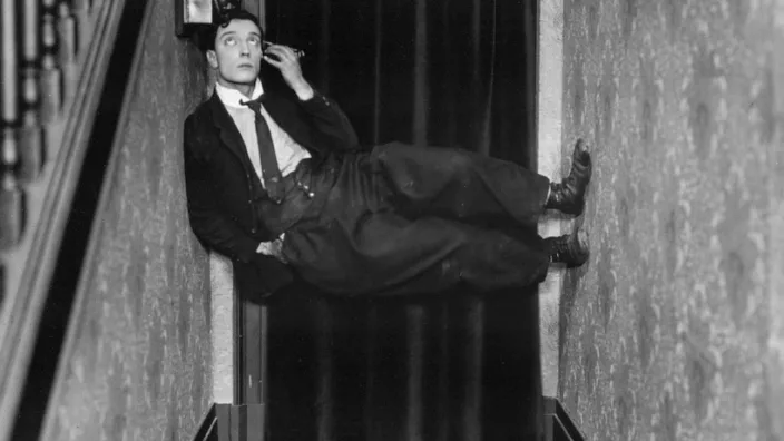 Buster Keaton speaking on the phone in the hallway and defying gravity