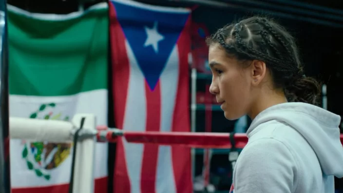 15-year-old Jesselyn Silva from New Jersey takes to the boxing ring in a grey hoodie