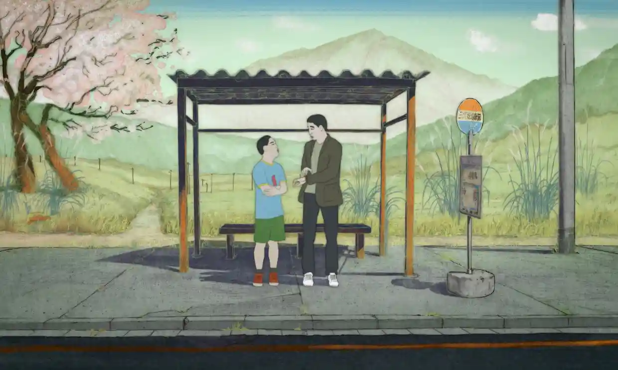 A boy in shorts and a man in sneakers talk at a bus stop in the country side.