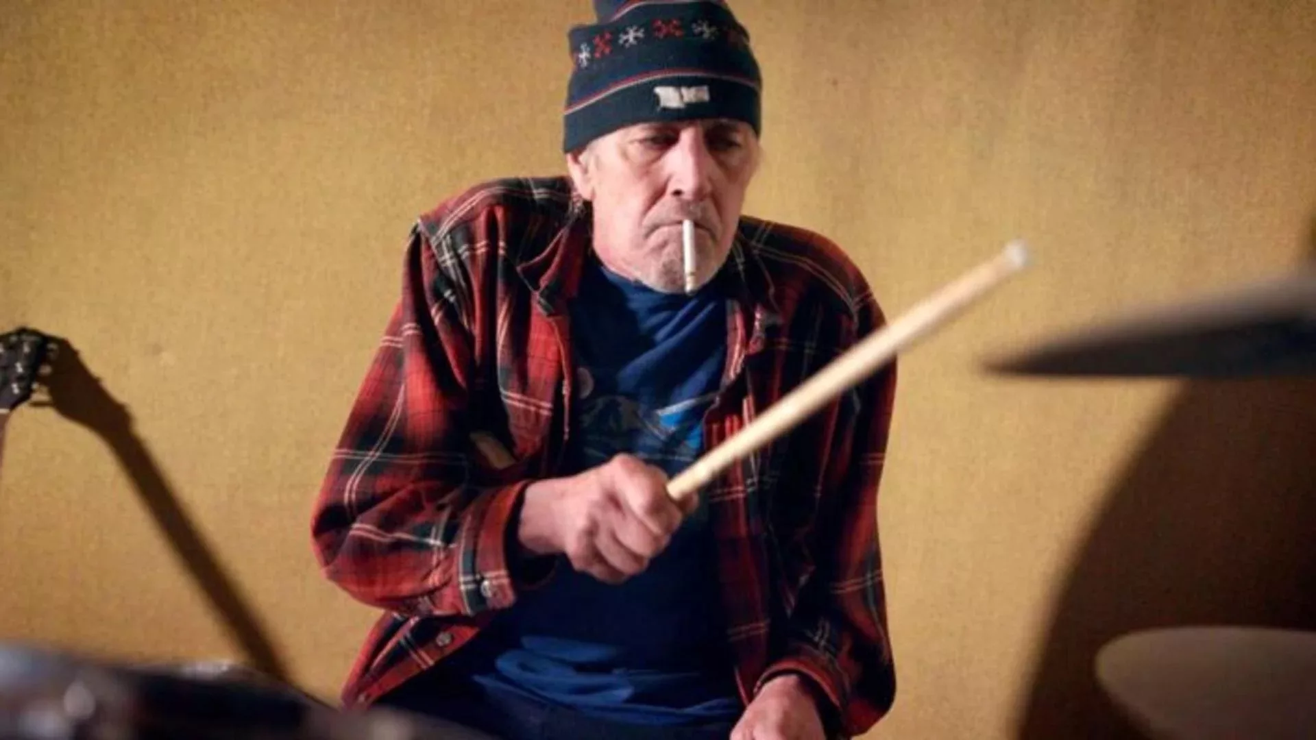 Drummer Gary Young (of indie rock royalty Pavement) drums with a cigarette in his mouth