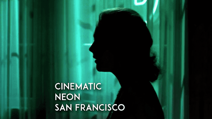 Womans face in profile and dark shadow with glowing neon light behind. Text on image reads cinematic neon san francisco.
