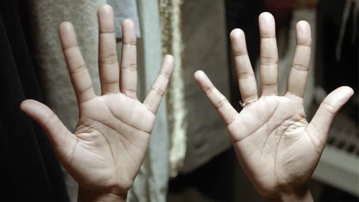 The palm side of a pair of hands with fingers spread