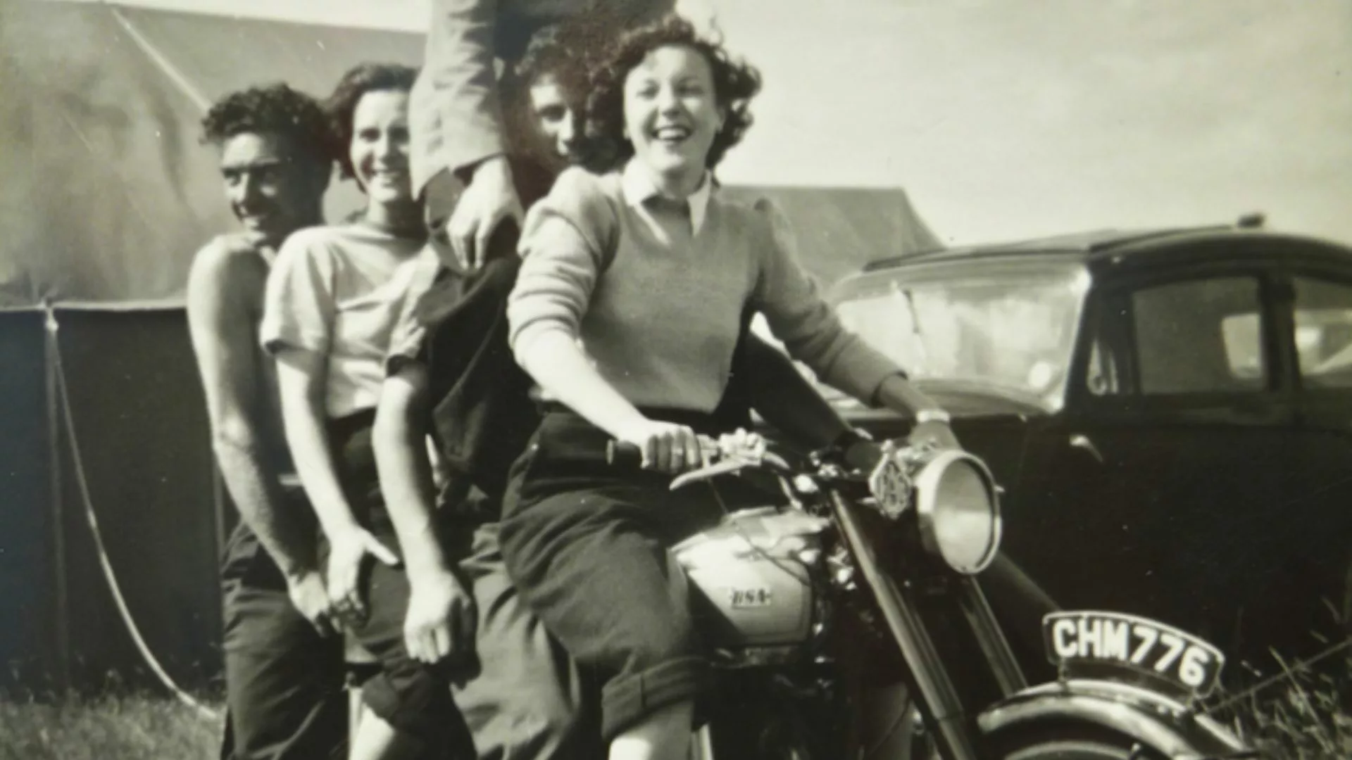Women on a motorcycle.