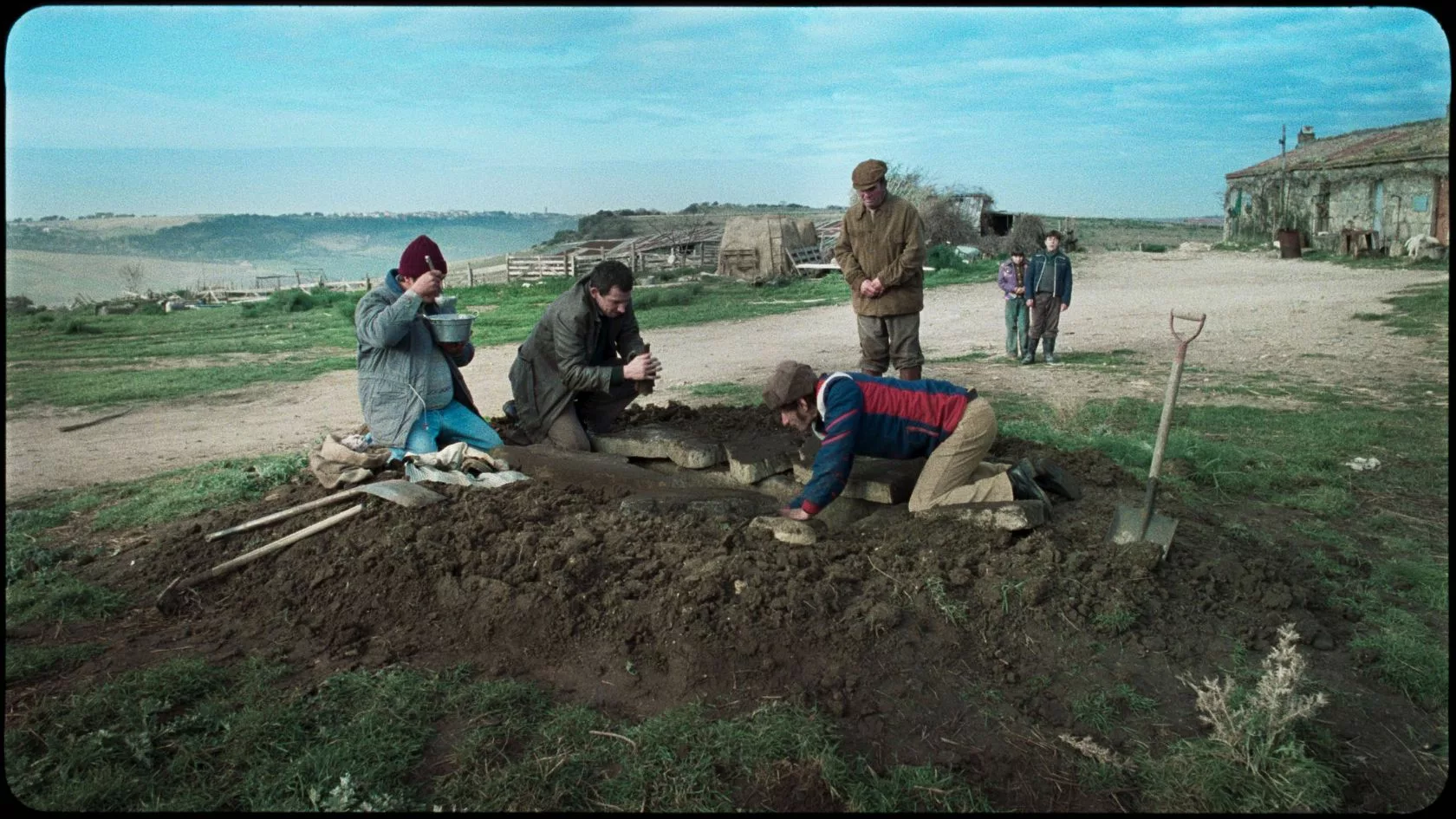 people digging a grave.