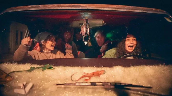 a group of teenagers in a van
