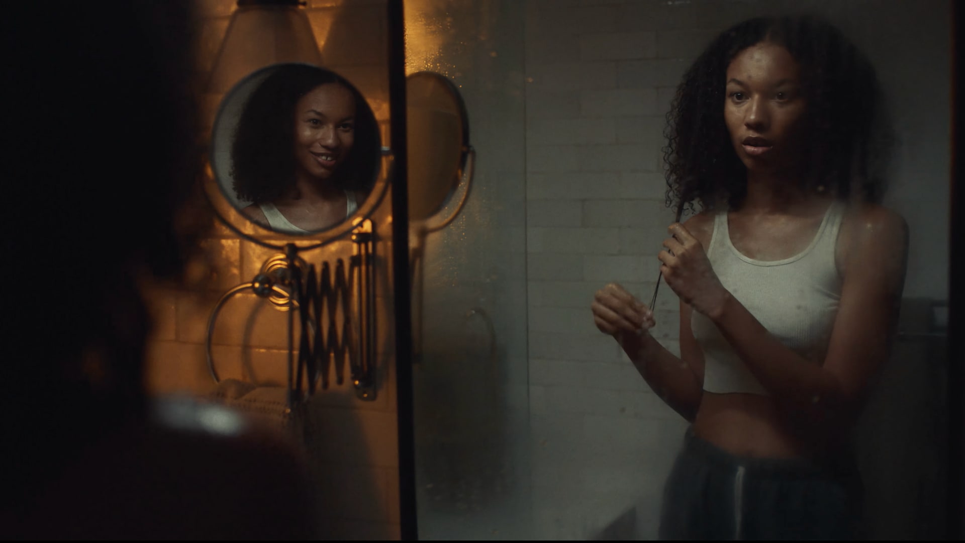 Teen girl looking concern at her reflection